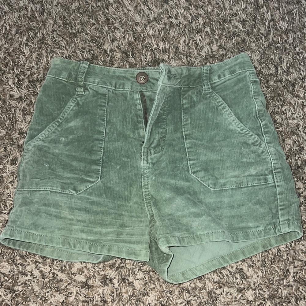 Adorable green but she corduroy shorts!